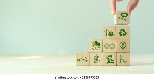 Low carbon,carbon neutral concept. Net zero greenhouse gas emissions target. Climate neutral long term strategy. Hand put wooden cubes with decarbonization icon and green icon. Green banner. LCA. ISO.