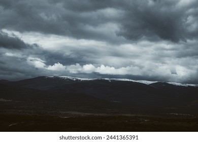 low clouds drifting over majestic mountain peaks. Mystery, tranquility nature scene. Snow-capped summits rise majestically into a sky. Natural world. - Powered by Shutterstock