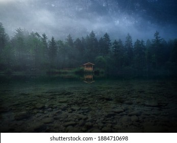 Low clouds fog misty mood reflection forest wood cabin in clear calm alpine mountain Lake Bluntausee Salzburg Austria - Powered by Shutterstock