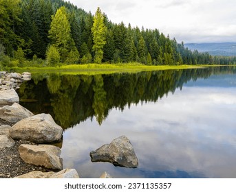 Low Clouds and Forested Shoreline Reflection on The Still Waters of Trillium Lake, Mount Hood National Forest, Oregon, USA