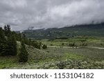 Low Clouds Hover Over Green Valley in Wyoming wilderness