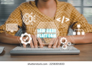 Low Code software development platform technology concept, Woman hand typing on keyboard computer with Low Code software development platform icon on virtual screen.