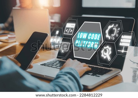 Low Code software development platform technology concept, Woman hand typing on keyboard computer with Low Code software development platform icon on virtual screen.