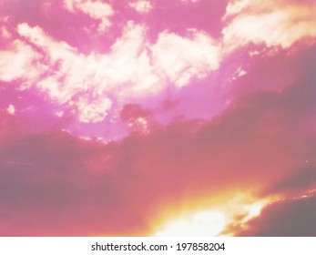 A low contrast filtered image of a dramatic sunset cloudscape