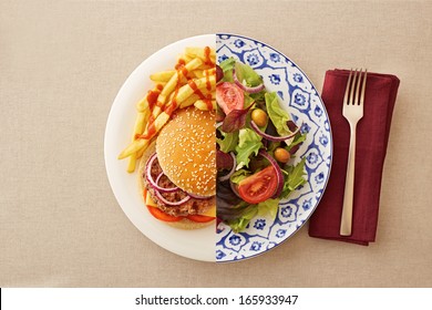 Low Fat Healthy Salad Against Unhealthy Greasy Burger