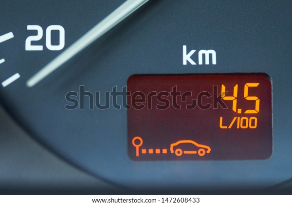 Low fuel consumption showed by\
the car board computer on the dashboard. The figures on the\
dashboard show the fuel consumption of 4.5 liters per 100\
kilometers