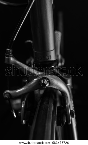 low key black and white silhouette of bicycle\
black background