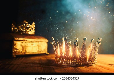 low key image of beautiful queen or king crown and gold treasure chest. vintage filtered. fantasy medieval period - Shutterstock ID 2084384317