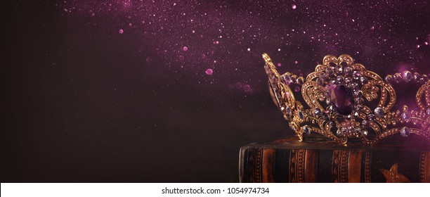 low key image of beautiful queen/king crown over wooden table. vintage filtered. fantasy medieval period - Shutterstock ID 1054974734