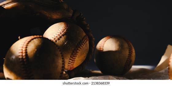 Low Key Lighting On Vintage Baseball Equipment From Sports Game.