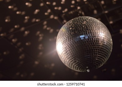 Low Key Photography On Disco Ball Spinning Under Bright Disco Lights Retro 80s Party Theme Interior