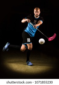 Low Key Photography Of A Shooting Floorball Player. 