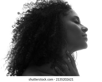 Low Key Portrait Of An Attractive Curly Woman