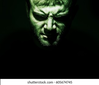 Low Key Portrait Of Evil, Devil, Bad, Angry Face Of Man On A Black Background, Dark Side Human Soul, Crazy