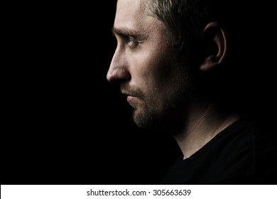 low key portrait of young man - Powered by Shutterstock