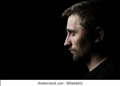 Low Key Portrait Of Young Man