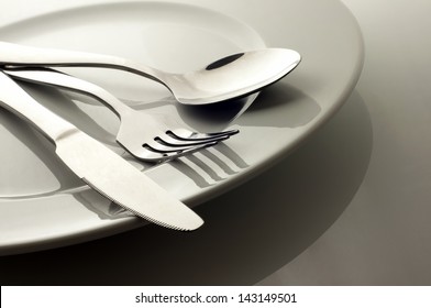 Low key shot-forks and knives on plate