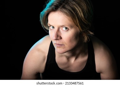 Low Key Studio Portrait Of A 35 Year Old White Woman