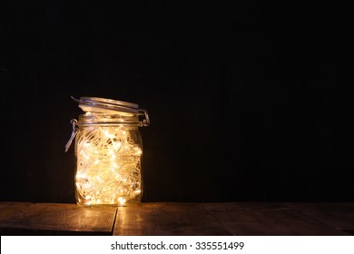 low key and vintage filtered image of fairy lights in mason jar with. selective focus
 - Powered by Shutterstock