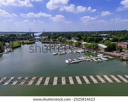low level aerial view of the re-developed docks area and new marina in Preston, Lancashire, England 