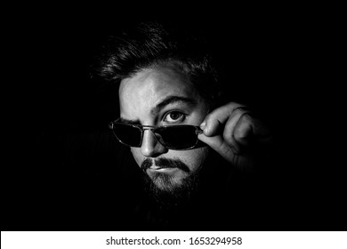 Low Light Monochrome Portrait Of A Man With Sunglasses