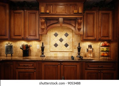 A Low Light Photo Of A Warm Beautiful Kitchen