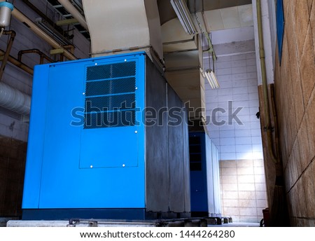 Low light view inside of factory. Low view of the old Machine control room for on - off the large air pumps.