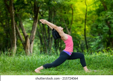 Low Lunge Yoga Pose In The Garden