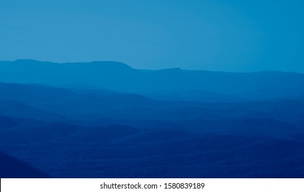 Low Mountains In Mist Colored In Trendy Classic Blue Pantone Color Of The Year 2020