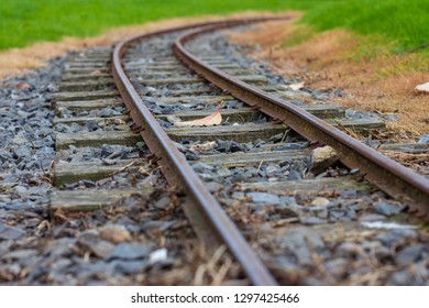 Low Perspective Image Of Narrow Guage Railroad Tracks For A Children's Train In Agnew Park, Stranraer, Scotland, United Kingdom