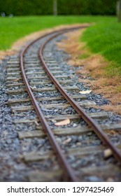 Low Perspective Image Of Narrow Guage Railroad Tracks For A Children's Train In Agnew Park, Stranraer, Scotland, United Kingdom