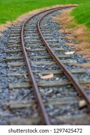 Low Perspective Image Of Narrow Guage Railroad Tracks For A Children's Train In Agnew Park, Stranraer, Scotland, United Kingdom