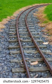 Low Perspective Image Of Narrow Guage Railroad Tracks For A Children's Train In Agnew Park, Stranraer, Scotland, United Kingdom