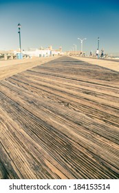 Low Perspective Of Old Wood Boardwalk On New Jersey Shore