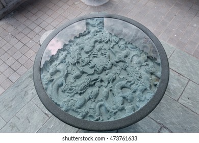 Low relief dragon gods on table with glass in Goof wish garden, Sik Sik Yuen Wong Tai Sin Temple - top view - Shutterstock ID 473761633