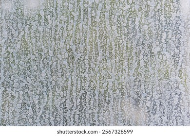 A low resolution, pixelated image with an abstract pattern in muted colors gray, white, green, blue, a
