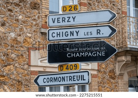 Low season in winter in Champagne wine making region near Epernay, Champagne, France. Road signes and places of destinations, Gran Cru village, black road sign english translation: tourists route 