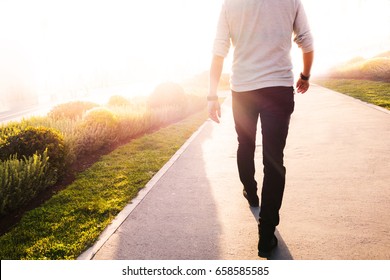 Low Section Of A Man Walking In The Park