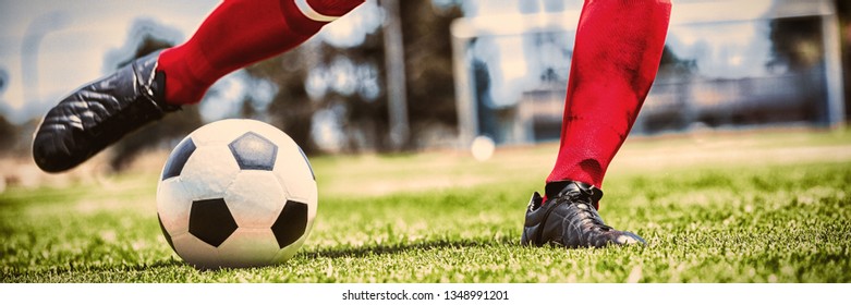 Low section of player practicing soccer on playing field - Powered by Shutterstock