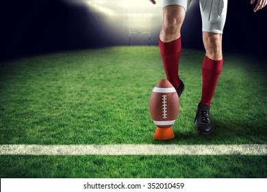 Low section of sports player kicking ball against rugby pitch - Powered by Shutterstock