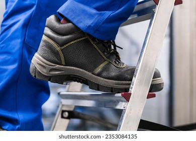 Low Section View Of A Handyman's Foot Climbing Ladder - Powered by Shutterstock