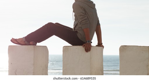 low section view of a man Sitting and Watching the ocean