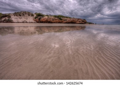 Low Tide In Coral Bay On A Rainy And Cloudy Day, Western Australia.