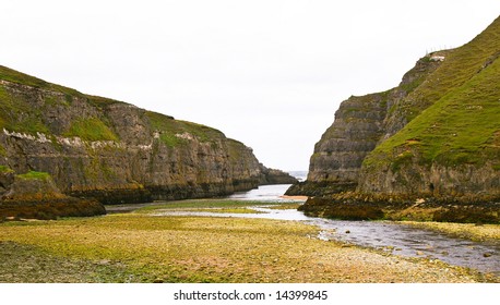 low tide with dangerous cliffs