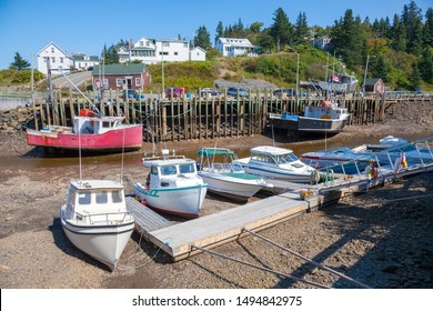 Low Tide  Fishing Boats At Hall's Harbour On The Bay Of Fundy, Nova Scotia.