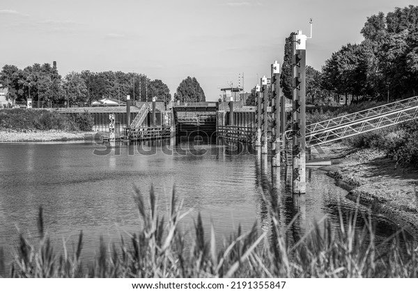 Low tide at the lock to the harbor of the city\
of Deventer