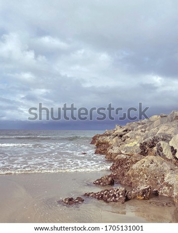 Similar – Image, Stock Photo Beach with orange rocks in a sunset, ribadeo, lugo, galician, spain