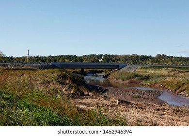 Low Tide As The St Croix River Flows Under A Bridge In Nova Scotia