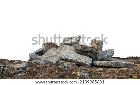 Low View Isolate Debris of large concrete blocks are piled up on the mounds of road demolition for renovations, which are common during the summer in rural Thailand.