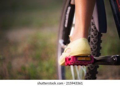 Low Viewing Angle Of Woman Leg On Mountain Bike Pedal